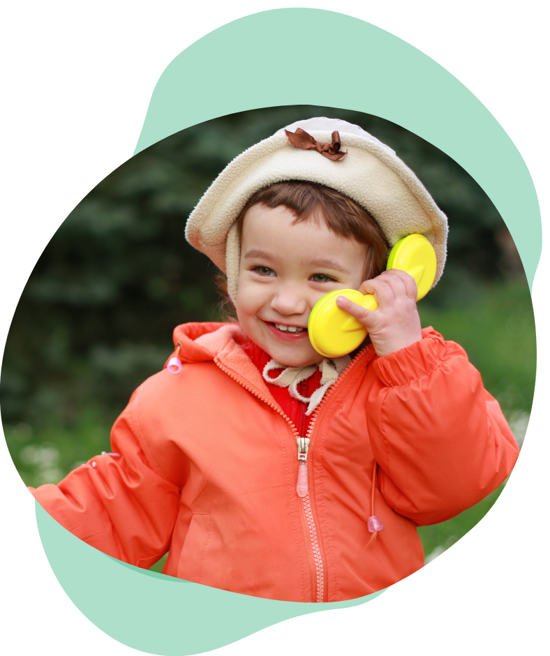 young child with a toy phone