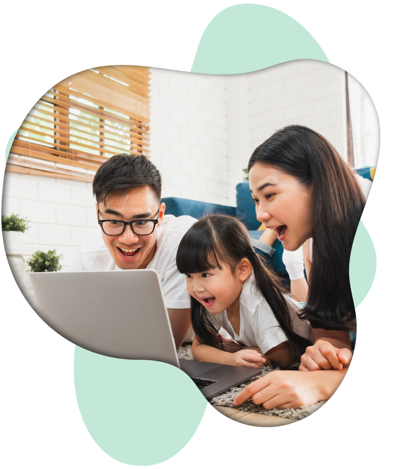 Mom and Dad looking at computer with daughter